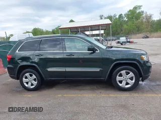 2011 Jeep Grand Cherokee 70th Anniversary with VIN 1J4RR4GG3BC631831, listed as a IAAI auction lot 42038415 with 130,811 mi miles. Bid and sale history available at carsss.com. Image 13.