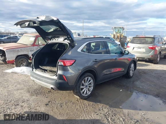 2021 Ford Escape Titanium Hybrid z VIN 1FMCU0DZ0MUB00944, wystawiony jako IAAI lot #41202146 z przebiegiem 52 458 mil mil oraz . Historia ofert i sprzedaży dostępna na DreamBid. Obrazek 4.