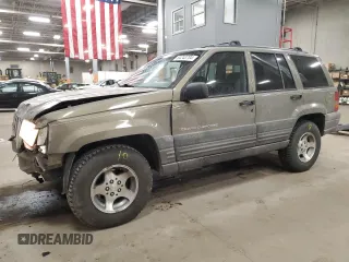 1998 Jeep Grand Cherokee Laredo with VIN 1J4GZ58S3WC207166, listed as a Copart auction lot 84243704 with 124,084 mi miles and Salvage Title. Bid and sale history available at carsss.com. Image 1.