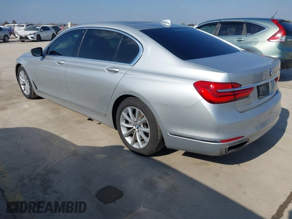 2016 BMW 7 Series 740i with VIN WBA7E2C5XGG739099, listed as a IAAI auction lot 41526038 with 123,900 mi miles. Bid and sale history available at carsss.com. Image 3.