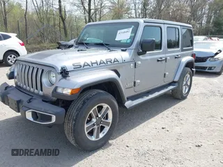 2018 Jeep Wrangler Unlimited Sahara with VIN 1C4HJXEG4JW141540, listed as a IAAI auction lot 42148402 with 43,909 mi miles and . Bid and sale history available at DreamBid. Image 2.