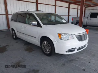 2014 Chrysler Town & Country Touring-L with VIN 2C4RC1CG2ER312444, listed as a IAAI auction lot 42050774 with 124,010 mi miles. Bid and sale history available at carsss.com. Image 1.