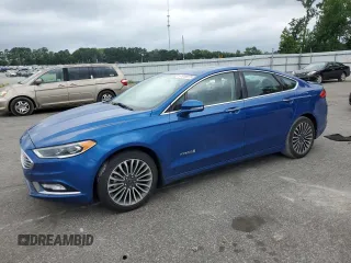 2017 Ford Fusion Hybrid Titanium z VIN 3FA6P0RU4HR368873, wystawiony jako Copart lot #61918075 z przebiegiem 141 713 mil mil oraz Szkoda całkowita • Salvage title. Historia ofert i sprzedaży dostępna na DreamBid. Obrazek 1.