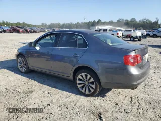2006 Volkswagen Jetta z VIN 3VWDG71K26M673879, wystawiony jako Copart lot #75674634 z przebiegiem 93 689 mil mil oraz Szkoda całkowita • Salvage title. Historia ofert i sprzedaży dostępna na DreamBid. Obrazek 2.