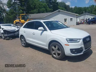 2015 Audi Q3 Prestige z VIN WA1GFCFS8FR010880, wystawiony jako IAAI lot #42639504 z przebiegiem 158 406 mil mil oraz . Historia ofert i sprzedaży dostępna na DreamBid. Obrazek 1.