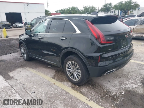 2024 Cadillac XT4 AWD Premium Luxury с VIN 1GYFZDR44RF147956, выставлен на аукционе IAAI как лот 42434595 с пробегом 26 328 миль миль и . История ставок и продаж доступна на DreamBid. Изображение 3.
