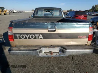 1993 Toyota T100 z VIN JT4VD10C2P0007486, wystawiony jako Copart lot #77669724 z przebiegiem 150 936 mil mil oraz Tytuł czysty. Historia ofert i sprzedaży dostępna na DreamBid. Obrazek 6.