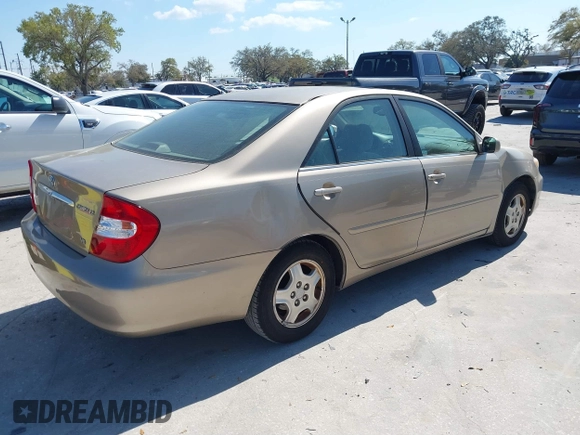 2002 Toyota Camry XLE z VIN 4T1BF30K82U018974, wystawiony jako IAAI lot #41712857 z przebiegiem 236 353 mil mil oraz . Historia ofert i sprzedaży dostępna na DreamBid. Obrazek 4.
