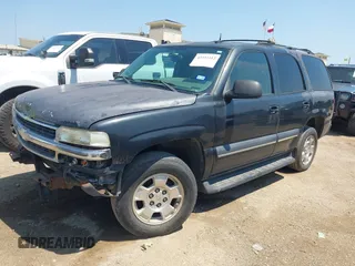 2004 Chevrolet Tahoe LS with VIN 1GNEC13T04R156427, listed as a IAAI auction lot 42333312 with 303,040 mi miles and . Bid and sale history available at DreamBid. Image 2.