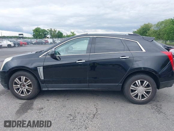2015 Cadillac SRX Luxury Collection z VIN 3GYFNEE34FS510360, wystawiony jako IAAI lot #42343737 z przebiegiem 149 046 mil mil oraz . Historia ofert i sprzedaży dostępna na DreamBid. Obrazek 14.