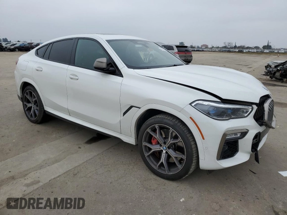 2021 BMW X6 M50i with VIN 5UXCY8C04M9D98395, listed as a Copart auction lot 85536134 with 57,891 mi miles and Salvage Title. Bid and sale history available at carsss.com. Image 4.