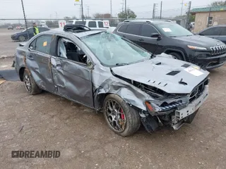 2014 Mitsubishi Lancer Evolution MR with VIN JA32W5FV7EU008165, listed as a IAAI auction lot 41553978 with 49,284 mi miles. Bid and sale history available at carsss.com. Image 1.