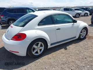 2012 Volkswagen Beetle Entry PZEV with VIN 3VWFP7AT2CM646744, listed as a IAAI auction lot 41963974 with 149,984 mi miles. Bid and sale history available at carsss.com. Image 4.