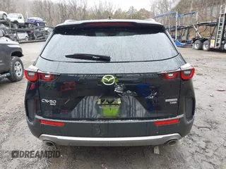 2024 Mazda CX-50 Premium z VIN 7MMVABDYXRN180263, wystawiony jako IAAI lot #41738791 z przebiegiem 9 688 mil mil oraz . Historia ofert i sprzedaży dostępna na DreamBid. Obrazek 16.