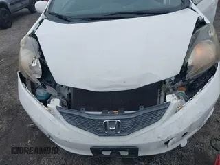 2013 Honda Fit with VIN JHMGE8H39DC005052, listed as a IAAI auction lot 41008236 with 124,874 mi miles. Bid and sale history available at carsss.com. Image 6.