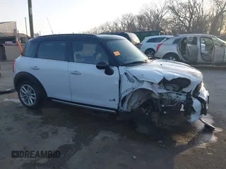 2015 MINI Cooper Countryman S with VIN WMWZC5C50FWP42324, listed as a IAAI auction lot 41795698 with 95,746 mi miles. Bid and sale history available at carsss.com. Image 13.