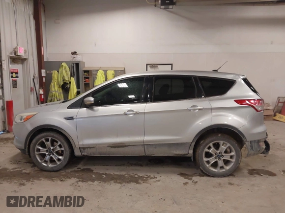 2013 Ford Escape SEL with VIN 1FMCU0H98DUC72150, listed as a IAAI auction lot 41213748 with 136,323 mi miles. Bid and sale history available at carsss.com. Image 13.