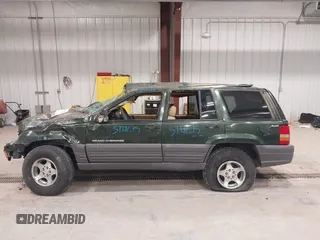 1997 Jeep Grand Cherokee Laredo z VIN 1J4GZ58YXVC729117, wystawiony jako IAAI lot #42244799 z przebiegiem Nie podano mil oraz . Historia ofert i sprzedaży dostępna na DreamBid. Obrazek 15.