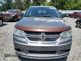 2013 Dodge Journey American Value with VIN 3C4PDCAB8DT566999, listed as a Copart auction lot 61361315 with 183,897 mi miles and Salvage title. Bid and sale history available at DreamBid. Image 5.