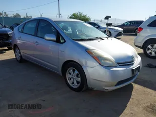 2007 Toyota Prius z VIN JTDKB20U477567380, wystawiony jako IAAI lot #42323632 z przebiegiem 193 349 mil mil oraz . Historia ofert i sprzedaży dostępna na DreamBid. Obrazek 1.