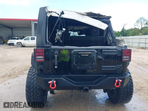 2015 Jeep Wrangler Unlimited Rubicon Hard Rock with VIN 1C4HJWFG0FL674700, listed as a IAAI auction lot 42511949 with 138,370 mi miles and . Bid and sale history available at DreamBid. Image 16.