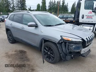 2014 Jeep Cherokee Latitude with VIN 1C4PJLCS1EW105984, listed as a IAAI auction lot 42242732 with 89,325 mi miles and . Bid and sale history available at DreamBid. Image 1.