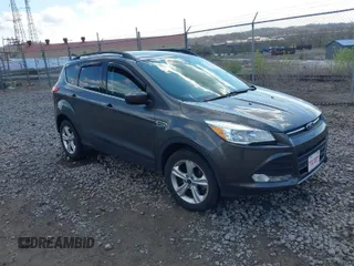 2016 Ford Escape SE with VIN 1FMCU9GX5GUA06660, listed as a IAAI auction lot 42043031 with 87,719 mi miles. Bid and sale history available at carsss.com. Image 1.