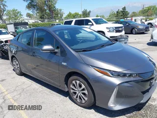 2022 Toyota Prius LE z VIN JTDKAMFP3N3203004, wystawiony jako IAAI lot #42326756 z przebiegiem 126 709 mil mil oraz . Historia ofert i sprzedaży dostępna na DreamBid. Obrazek 1.
