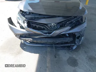 2019 Toyota Camry LE with VIN 4T1B11HK8KU204599, listed as a IAAI auction lot 42096889 with 76,518 mi miles and . Bid and sale history available at DreamBid. Image 12.