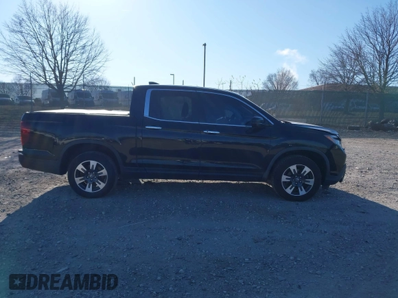 2019 Honda Ridgeline RTL-E with VIN 5FPYK3F7XKB033652, listed as a IAAI auction lot 41751421 with 96,774 mi miles and . Bid and sale history available at DreamBid. Image 12.