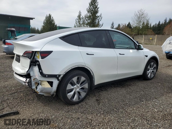2023 Tesla Model Y Long Range with VIN 7SAYGDEE6PA101291, listed as a Copart auction lot 52758115 with 7,250 mi miles and Salvage Title. Bid and sale history available at DreamBid. Image 3.