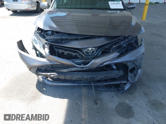 2019 Toyota Camry LE with VIN 4T1B11HK8KU204599, listed as a IAAI auction lot 42096889 with 76,518 mi miles and . Bid and sale history available at DreamBid. Image 6.