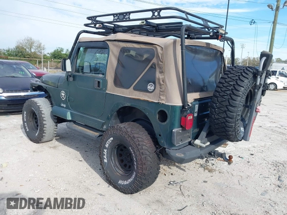 2000 Jeep Wrangler Sahara with VIN 1J4FA59SXYP743190, listed as a IAAI auction lot 41699142 with 1 mi miles. Bid and sale history available at carsss.com. Image 3.