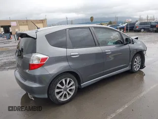 2013 Honda Fit Sport with VIN JHMGE8H52DC018498, listed as a IAAI auction lot 41935157 with 111,922 mi miles. Bid and sale history available at carsss.com. Image 4.