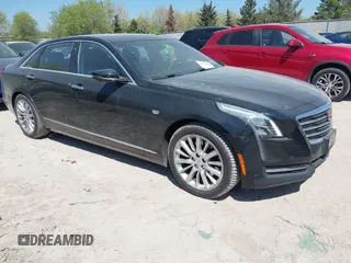 2017 Cadillac CT6 AWD z VIN 1G6KB5RS9HU138311, wystawiony jako IAAI lot #42226463 z przebiegiem 88 129 mil mil oraz . Historia ofert i sprzedaży dostępna na DreamBid. Obrazek 1.