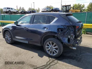 2021 Mazda CX-5 Grand Touring with VIN JM3KFBDM3M1344784, listed as a Copart auction lot 58051445 with 69,593 mi miles and Salvage title. Bid and sale history available at DreamBid. Image 2.