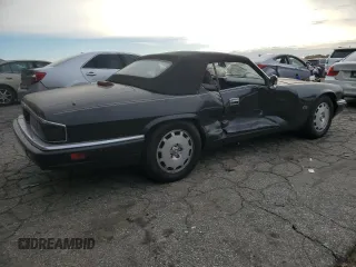 1996 Jaguar XJS with VIN SAJNX2740TC225643, listed as a Copart auction lot 80975784 with 98,427 mi miles and Salvage Title. Bid and sale history available at carsss.com. Image 3.
