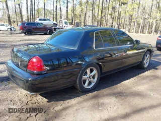 2003 Mercury Marauder with VIN 2MEHM75V33X628952, listed as a IAAI auction lot 41534323 with 92,228 mi miles. Bid and sale history available at carsss.com. Image 4.