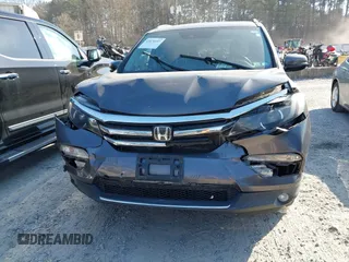 2016 Honda Pilot Elite with VIN 5FNYF6H01GB050555, listed as a IAAI auction lot 41670197 with 140,000 mi miles. Bid and sale history available at carsss.com. Image 12.