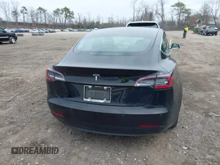 2019 Tesla Model 3 Mid Range with VIN 5YJ3E1EA2KF395549, listed as a IAAI auction lot 41895977 with 97,108 mi miles and . Bid and sale history available at carsss.com. Image 16.