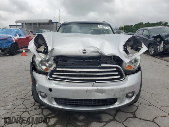 2012 MINI Countryman with VIN WMWZB3C5XCWM06778, listed as a Copart auction lot 61201285 with 64,676 mi miles and Salvage title. Bid and sale history available at DreamBid. Image 5.