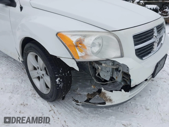 2011 Dodge Caliber Mainstreet with VIN 1B3CB3HAXBD237906, listed as a IAAI auction lot 41589696 with 135,909 mi miles and . Bid and sale history available at DreamBid. Image 6.