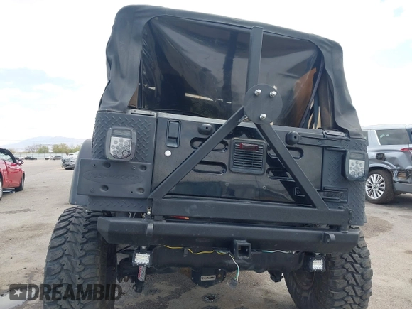 2004 Jeep Wrangler Rubicon z VIN 1J4FA69S84P727716, wystawiony jako IAAI lot #42162129 z przebiegiem 90 844 mil mil oraz . Historia ofert i sprzedaży dostępna na DreamBid. Obrazek 17.