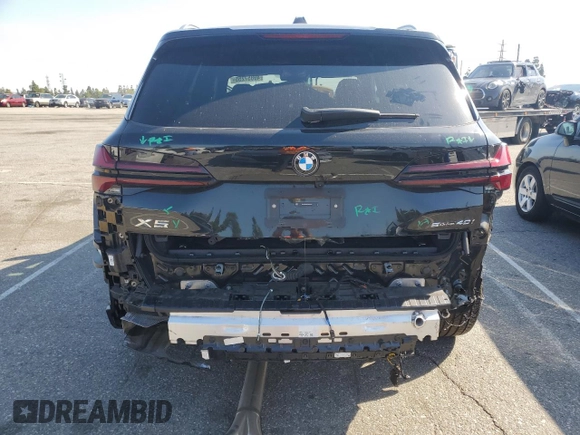 2025 BMW X5 sDrive40i with VIN 5UX13EU05S9W82678, listed as a Copart auction lot 49857255 with 9,901 mi miles and Salvage Title. Bid and sale history available at carsss.com. Image 6.