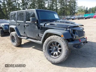 2015 Jeep Wrangler Unlimited Willys Wheeler with VIN 1C4BJWDG9FL750049, listed as a IAAI auction lot 42136188 with 115,328 mi miles and . Bid and sale history available at DreamBid. Image 1.
