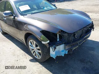 2015 Infiniti Q70 z VIN JN1BY1AR1FM560845, wystawiony jako IAAI lot #42165981 z przebiegiem 75 767 mil mil oraz . Historia ofert i sprzedaży dostępna na DreamBid. Obrazek 18.