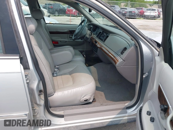1999 Mercury Grand Marquis LS z VIN 2MEFM75W7XX659031, wystawiony jako IAAI lot #42362387 z przebiegiem 140 067 mil mil oraz . Historia ofert i sprzedaży dostępna na DreamBid. Obrazek 5.