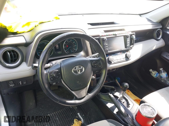 2016 Toyota RAV4 Hybrid XLE with VIN JTMRJREVXGD029019, listed as a IAAI auction lot 42021530 with 74,400 mi miles. Bid and sale history available at carsss.com. Image 20.