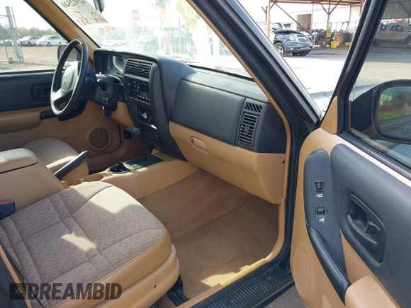 1998 Jeep Cherokee Sport with VIN 1J4FT68S8WL131348, listed as a IAAI auction lot 41912540 with 111,579 mi miles. Bid and sale history available at carsss.com. Image 5.