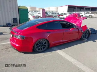 2022 Tesla Model S Plaid with VIN 5YJSA1E61NF460253, listed as a IAAI auction lot 40328727 with Not provided miles and . Bid and sale history available at DreamBid. Image 4.